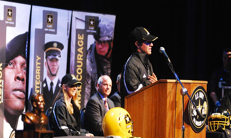 Filled with pride—Senior Tommy Militello gives a speech thanking his peers, parents and band instructor Marty Martone as All-American senior Sandy Babich and Martone look on to the audience in the All-American acceptance assembly that took place on Wednesday, Oct. 10 during fifth period.