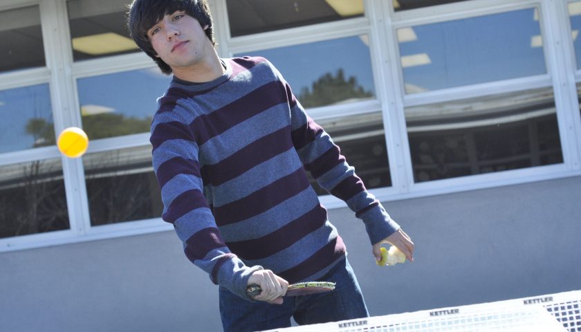 PONGING—Sophomore Spencer Flynn plays Ping-Pong during lunch with fellow club goers.