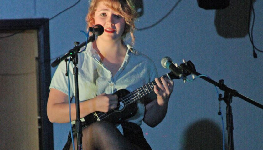 plucking for pennies—Junior Kenzy Peach sings “Here Comes Your Man” with her ukulele at CSF’s benefit concert in an effort to raise funds.