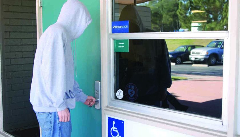 Intruder—Senior Ian Doherty poses as a unwanted visitor attempting to enter the campus unauthorized. This shows how easily campus security can be compromised if the security staff were not alert.