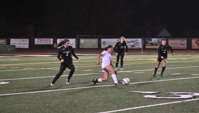 Sophomore Ana Cordoba slides as she tries to regain possession of the ball. 