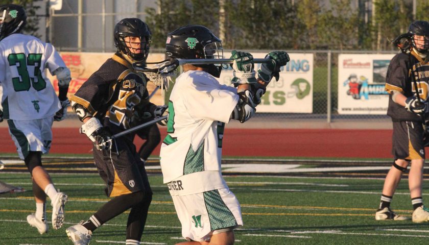 Dump it in— Junior midfielder Connor Koeritz looks to pass the ball into the crease during a recent game at home. The Lancers won 12–2 over Calabasas.