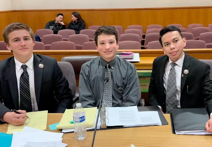 Pictured left to right, lead counsels sophomore Finneas Kerns, junior Aidan Light and junior Dominic Anderson sit at the Ventura County Courthouse defense table.