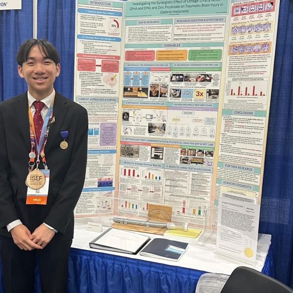 A LOVE FOR SCIENCE  - Benjamin Chung stands next to his project that placed in the top three at the Regeneron International Science and Engineering Fair.